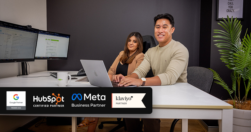 click click media team members at agency office with partner badges for google, hubspot, meta, and klaviyo